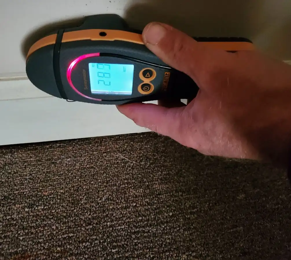 Moisture detection at baseboard during Storm Damage Restoration in Thetford